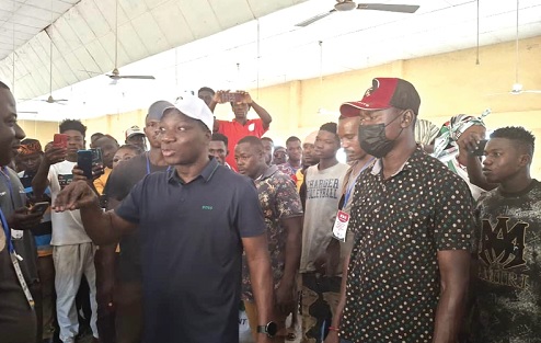 Oti Bless interacting with some NDC supporters