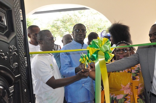  Prof. Samuel Ato Duncan (2nd from left), President of the Ghana Federation of Traditional Medicine Practitioners Associations, being assisted by Prof. Lydia Aziato (2nd from right), Vice-Chancellor of UHAS, and other officials of UHAS to cut the ribbon