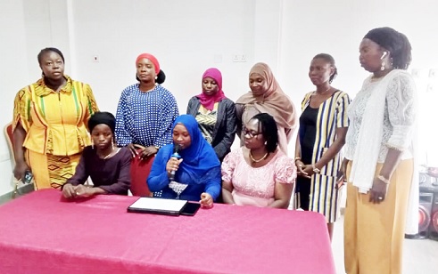 Faidatu Alhassan (seated middle), UDS Administrator, presenting the communique. Looking on  are some executives of women 