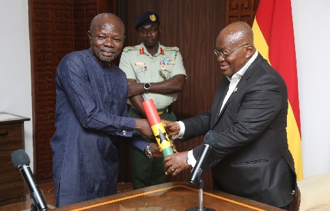 President Akufo-Addo (right) presenting the instrument of office to Dr Benjamin Barfo-Bonnie, Deputy Commissioner of CHRAJ, at the Jubilee House. Picture: SAMUEL TEI ADANO