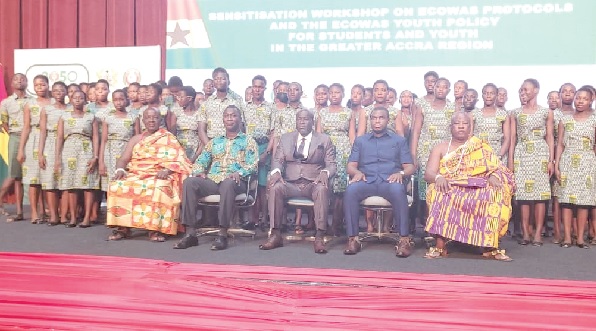 Ramses Joseph Cleland (seated 2nd from left), Chief Director of the MFARI; Daniel Nii Kwartei Titus-Glover (seated in the middle), the Greater Accra Regional Minister, and Dr Eric Nkansah (2nd from right), Director-General of the Ghana Education Service, and some traditional authorities with a section of the participating students