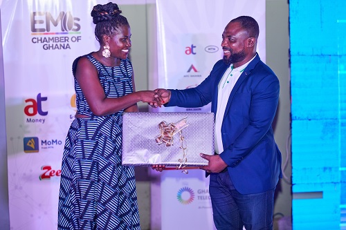 Augusta Andrew (left), an executive member of the Telecoms Chamber, presenting the award to Suleiman Mustapha 