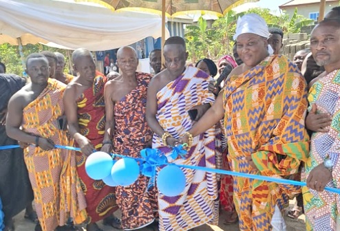 Nana Akosua Serwaa Seoyo I (2nd from right), the Queenmother of Ahenmronomu, being assisted by some chiefs to cut the ribbon to inaugurate the project Nana Akosua Serwaa Seoyo I (2nd from right), the Queenmother of Ahenmronomu, being assisted by some chiefs to cut the ribbon to inaugurate the project
