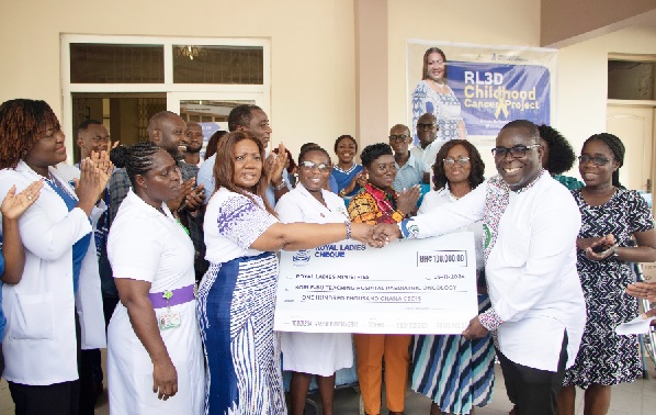 Rev. Mrs Rita Korankye-Ankrah (3rd from left), Founder and President of Royal Ladies Ministries International, presenting a cheque for GH¢100,000 to Dr Frank Owusu-Sekyere (2nd from right), acting Chief Executive Officer of the KBTH, during the ceremony. Looking on are some officials of KBTH, and members of the Royal Ladies Ministries International. Picture: EDNA SALVO KOTEY