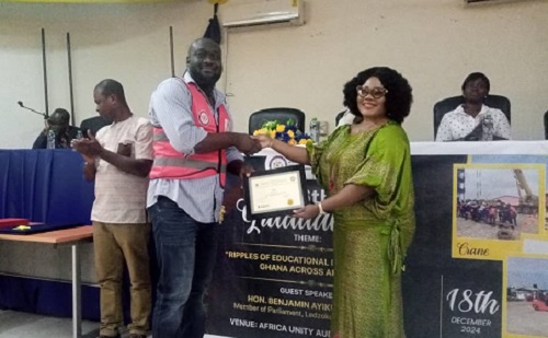 Agnes Naa Momo Lartey (right), Member of Parliament for the Krowor Constituency,  presenting a certificate to Nana Kofi Kye (left), who was adjudged  Best Student in Mobile Crane Operation