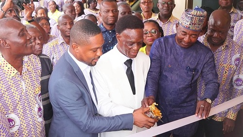 Morgan Ayawine (middle) cutting the tape to inaugurate the ICU House