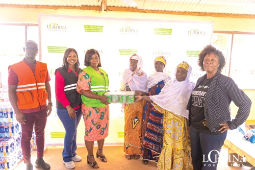  Priscilla Santuo-Ocrah (3rd from left), Board Secretary of Lordina Foundation, presenting the items to representatives of the Gambaga ‘witches’ camp
