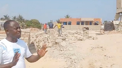  Emmanuel Gemegah, Municipal Chief Executive of Keta, explaining a point at one of the demolition sites. Picture: Timothy Gobah