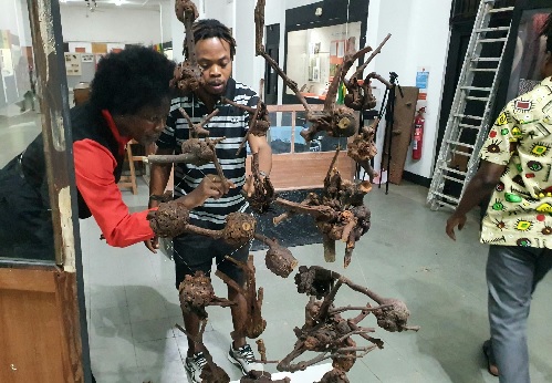 Some patrons observing the arts and sculptures at the exhibitions. Picture: ERNEST KODZI