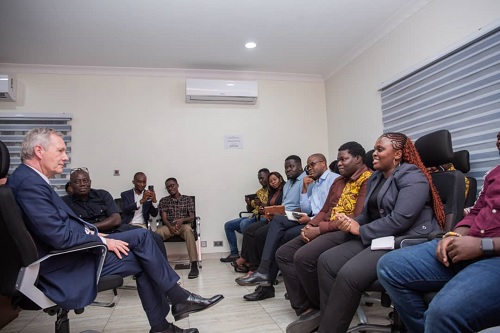 Christian Wilhelm Walter Wulff (left), former President of Germany, interacting with some of the workers at AmaliTech during the visit
