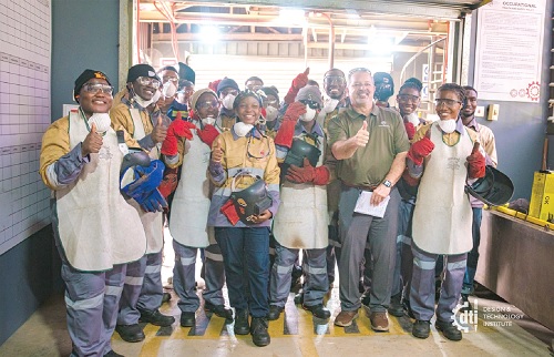 Some students of the DTI with Steve Snyder (2nd from right), a representative from AWS SENSE