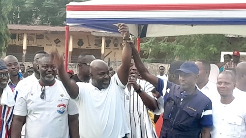 Michael Okyere Baafi (2nd left, hand raised) being declared as the parlaimentary candidate for New Juaben South by Kofi Asante Owusu (right), the Municipal Electoral Officer 