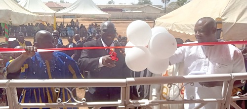 Justice Gbiel S. Suurbaareh (middle), an Appeals Court Judge, cutting the tape to inaugurate the new district court (left) at Zuarungu in the Bolgatanga East District