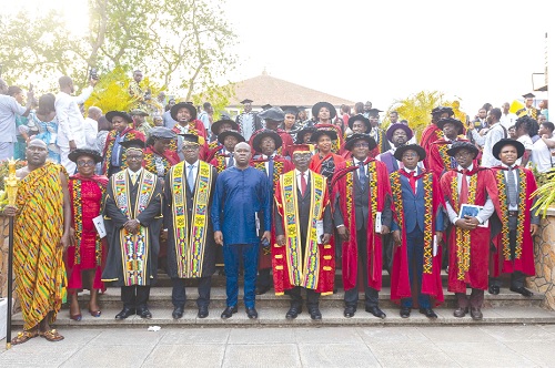 Kwamina Asomaning (arrowed), CEO of Stanbic Bank, with  members of convocation for the congregation after the ceremony