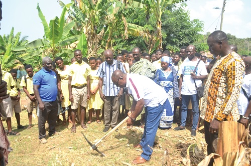 Ernest Parku, headmaster of the school, cutting the sod for the project to commence