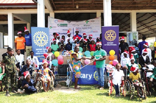 Eyram Heyi (right), the President of Rotary Club of Accra-Teshie Nungua, presenting the items to Hannah Jehu-Appiah (left),  caretaker at the facility