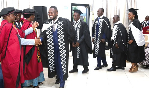 Graduates being congratulated by members of convocation at the 2023 graduation ceremony at the University of Ghana, Legon. Picture: SAMUEL TEI ADANO 