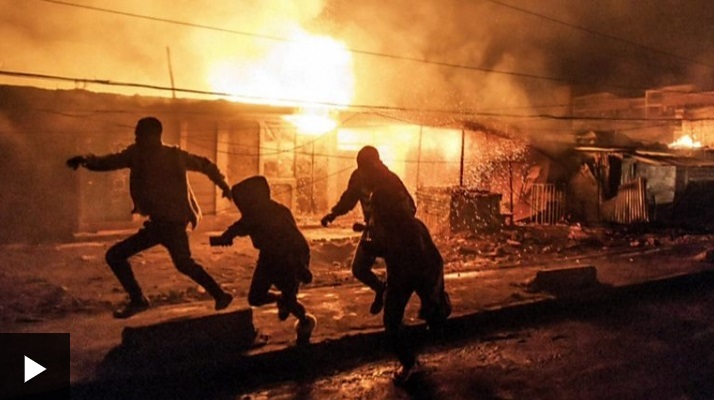 People flee fires and smoke after huge explosion