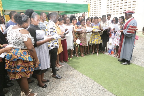 Smile Kobina Amittsi (right), Principal, School of Hygiene, taking students through the matriculating oath in Accra. Picture: SAMUEL TEI ADANO