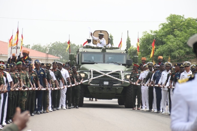 Vice Admiral Seth Amoama  in vehicle, outgoing Chief of Defence Staff, responds to cheers during the pull-out ceremony at the Burma Camp in Accra. Picture: ELVIS NII NOI DOWUONA