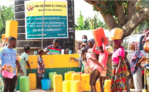 Some residents of Benim with their empty gallons fetching water from the newly commissioned borehole. Picture: EMMANUEL BAAH
