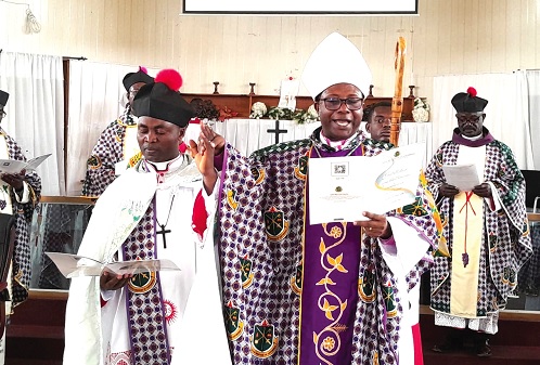 Rt. Rev. Felix Odei Annancy (middle), Bishop of the Koforidua Diocese of the Anglican Church, swearing in Rev. Venerable Nathan Ishmael Duodu Odoi, the new Archdeacon of Kyebi