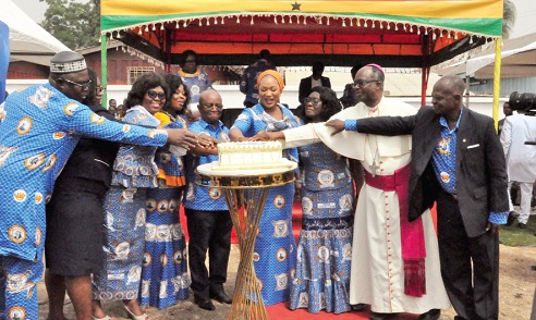 Samira Bawumia (middle) being assisted by Most Rev. Emmanuel Fianu (2nd from right), Catholic Bishop of Ho Diocese, Dr Archibald Yao Letsa (5th from left) and some past students of OLA SHS, to cut the anniversary cake