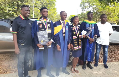 George Frimpong (left), Educational Portfolio Advisor at MTN, together with some of the beneficiaries who graduated