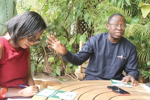 Augustine Tawiah, Staff Writer, Daily Graphic, interviewing Dr Opoku Opoku Ware Ampomah, Chief Executive Officer, Korle Bu Teaching Hospital at his residence in Accra. Picture: SAMUEL TEI ADANO