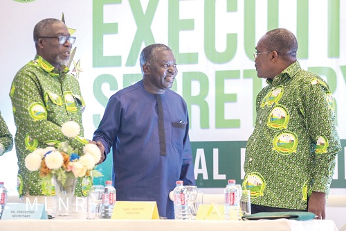Benito Owusu-Bio (middle), a Deputy Minister of Lands and Natural Resources, interacting with Benjamin Arthur (left),  acting Executive Secretary of the commission, and Alex Quaynor, Board Chairman, Lands Commission