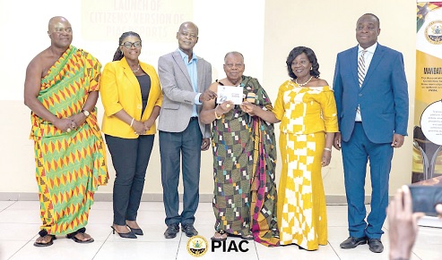 Prof. Nana S.K.B. Asante (3rd from right), Paramount Chief,  Asante Asokore, assisted by Dr Steve Manteaw (3rd from left), Co-Chair, GHEITI; Kathleen Addy (2nd from left), Chairperson, NCCE; Emerita Professor Elizabeth Ardayfio-Schandorf (2nd from right), Chair, PIAC, and others to launch the report