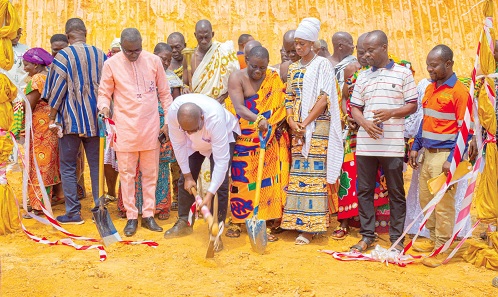 Shaddrack Adjetey Sowah (with pickaxe), Vice-President & MD of GSWL, cutting the sod for work to begin