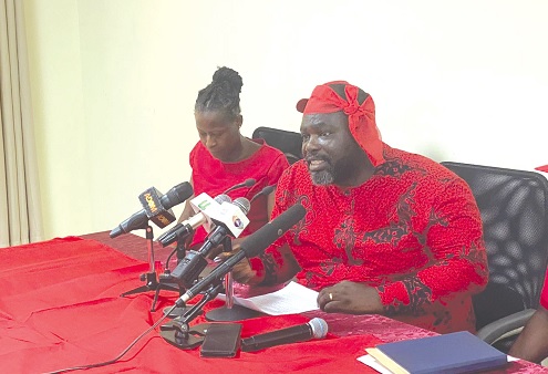 Patrick Benyemi (right), Greater Accra Regional Labour Chairperson, speaking at the news conference
