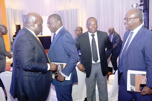Dr Amin Adam (2nd from left), Minister of State at the Ministry of Finance, interacting with  Kofi Adomakoh (left), Managing Director, GCB Bank PLC. With them are Dr Ernest Addison (right), Governor, Bank of Ghana, and Daniel Tweneboah Asirifi, acting Board Chairman, GCB Bank PLC. Picture: SAMUEL TEI ADANO