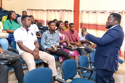 Kofi Takyi Kwakye (standing), Education officer, Ghana Commission for UNESCO, in a discussion with students of the Takoradi Technical University 