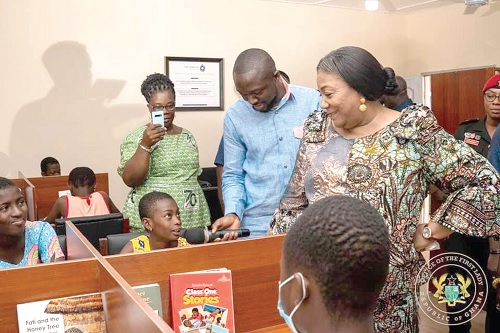 Rebecca Akufo-Addo (right), the First Lady, interacting with some pupils at the library
