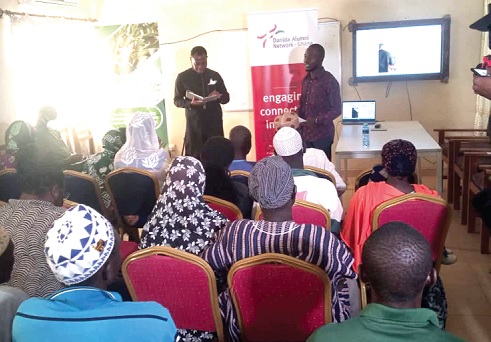 Eugene Dela Setsoafia, (standing left), Researcher at the Danida Alumini Network, interacting with participants