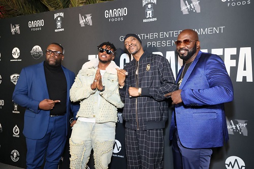 In the picture from the right ( Michael Harris, Snoop Dog , GAMBO, Terry Williams )  all pointing to GAMBO