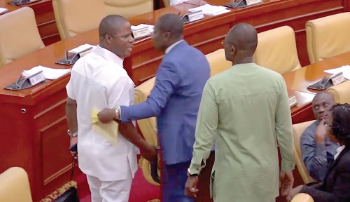Alexander Afenyo-Markin (middle), Deputy Majority Leader, intervening in the near scuffle between Kennedy Ohene Agyapong (right) and Sylvester Tetteh, his colleague 