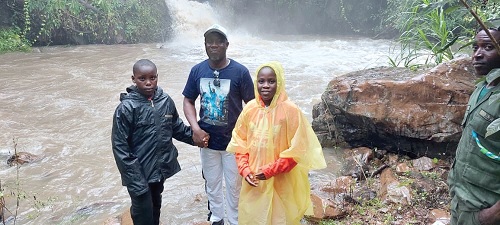 Noble Awume (middle), Hohoe MCE, with some local tourists at the Wli Waterfall