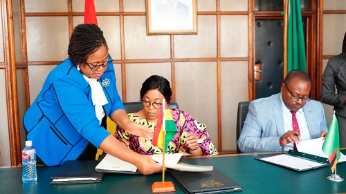Shirley Ayorkor Botchwey (left),  the Minister of Foreign Affairs and Regional Integration,  and Mulambo Haimbi, the Minister of Justice and acting Minister of Foreign Affairs and International Cooperation of Zambia, signing the memoranda of understanding in Lusaka, Zambia