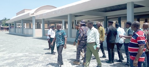  Noble Awume (arrowed), Hohoe MCE, leading some officials to inspect the new Hohoe Central Market