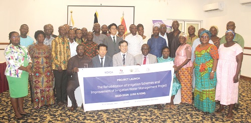 Yaw F. Addo (5th from right), Deputy Minister of Food and Agriculture, Dong Hyun Lee (seated 3rd from left), Country Director, KOICA Ghana, and Eric Samuel Abu-Dankwa (seated left), Director, PME & C/Project Coordinator- GIDA, displaying the banner of the project being launched in Accra with other participants. Picture: ESTHER ADJORKOR ADJEI