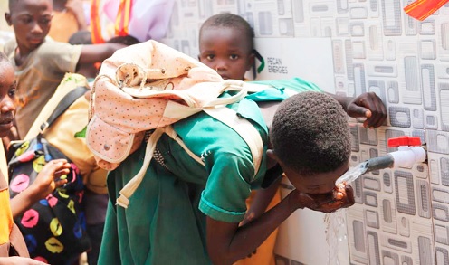 The pupils taking turns to taste the potable water provided. Picture: EMMANUEL BAAH