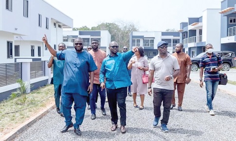 Francis Asenso-Boakye (middle), fomer Minister of Works and Housing, conducting officials round the project named after Hackman Owusu-Agyemang