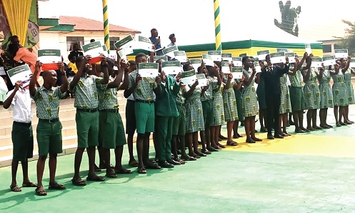 A section of the award winners displaying their certificates 