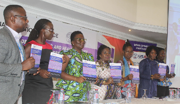 Dignitaries at the dissemination programme holding copies of the report on agency, consent and coercion: young people’s experiences of first sex in the Ashanti and Northern regions, Ghana. They include Dr Akosua Owusu-Ansah (3rd from left), Senior Lecturer of the University of Education, Winneba, who presented the findings of the report;  Dr Faustina Frempong-Ainguah (2nd from left), Deputy Government Statistician, and Dr Grace Bediako (3rd from right), the Board Chairman of the Ghana Statistical Service