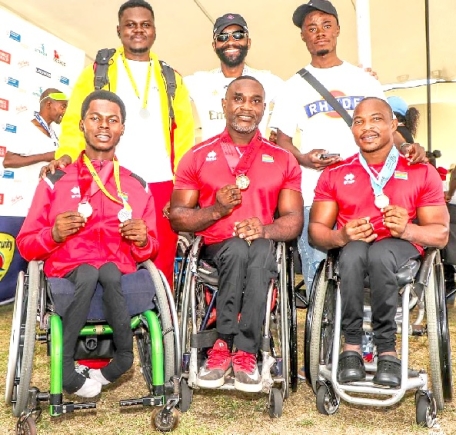 Seated from left: Emmanuel Kwaku Gyasi, Raphael Botsyo Nkegbe and Maclean Atsu Dzidzienyo displaying their medals