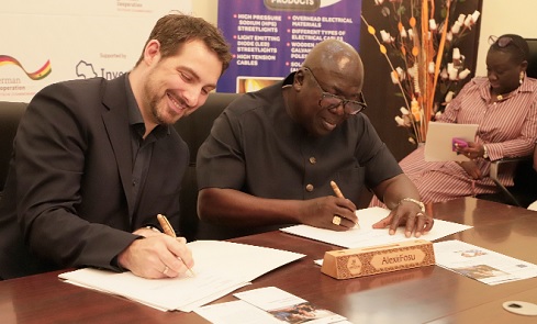 Alexie Kwasi Fosu (right), Chief Executive Officer of Prefos Limited, and Steffen Kuhl (left), Managing Director of Investing for Employment, signing the contract. Picture: EDNA SALVO-KOTEY