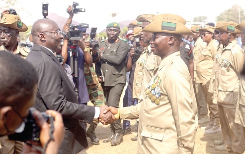 Vice-President Dr Mahamudu Bawumia (left) exchanging pleasantries with some veterans at the event in Accra. Picture: Caleb Vanderpuiye